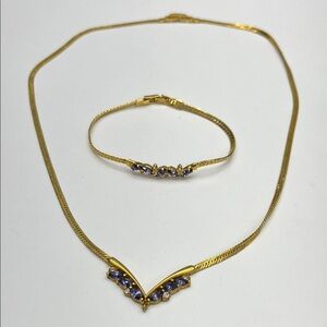 Vintage AVON gold tone choker necklace with sapphire crystals.
